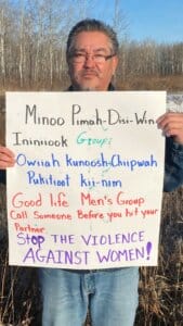 Brad Swan holding sign